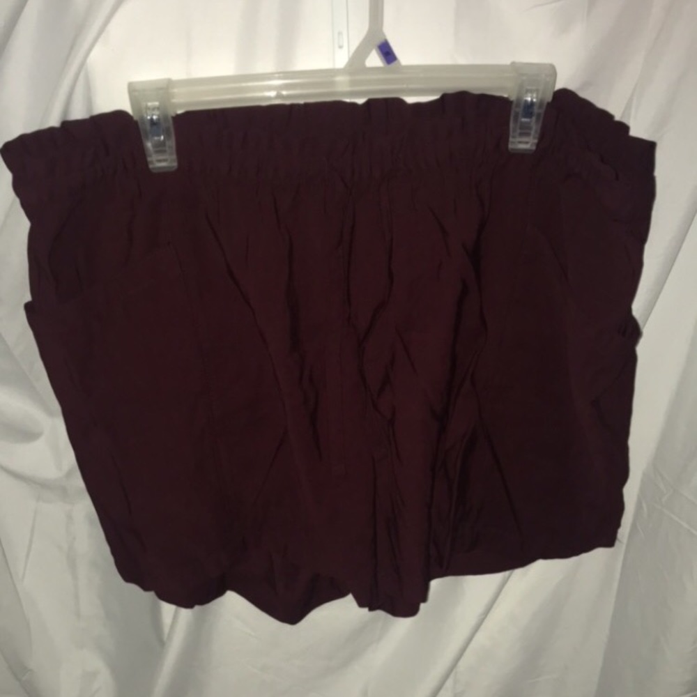 Maroon shorts with draw string and pockets. Size XL